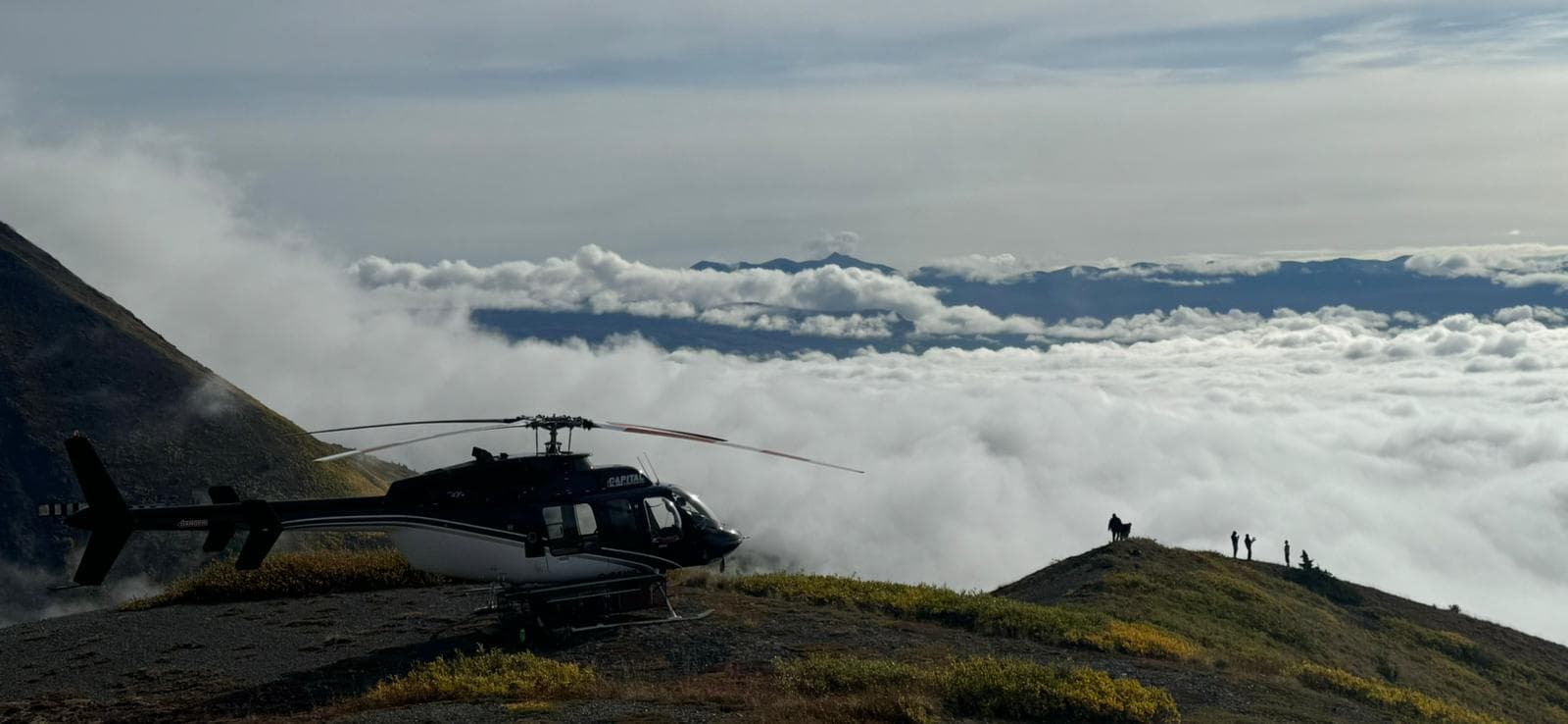 Capital Helicopters Bell above the clouds